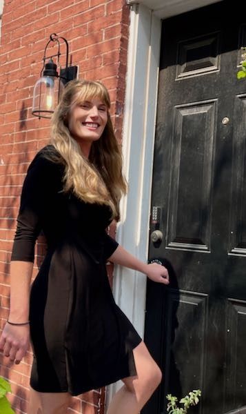 A HomeBuyer Brokerage client at her new front door.